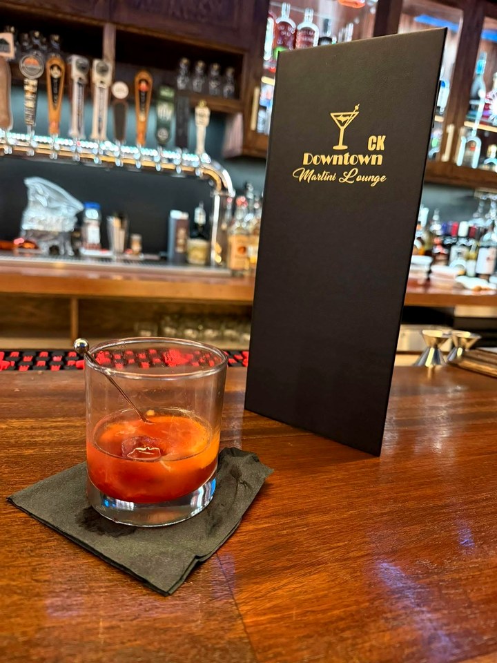 Old fashioned cocktail on the CK Downtown bar beside the lounge menu